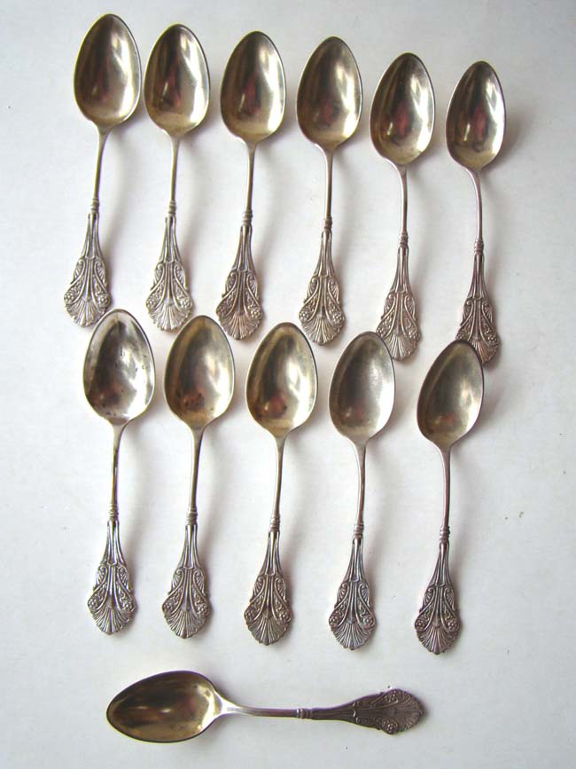A fine set of 12 American sterling silver teaspoons with gold washed bowls and patent date of 1876
